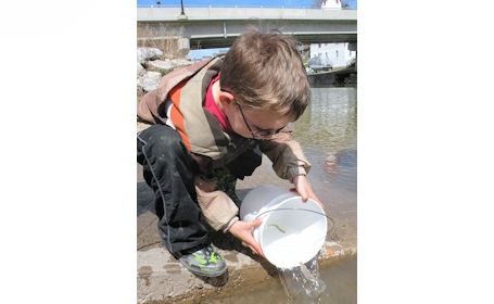 KTTPS students release fish beside Kincardine hatchery