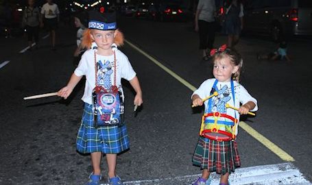 Final Kincardine Scottish Pipe Band Saturday night parade is a sparkly affair