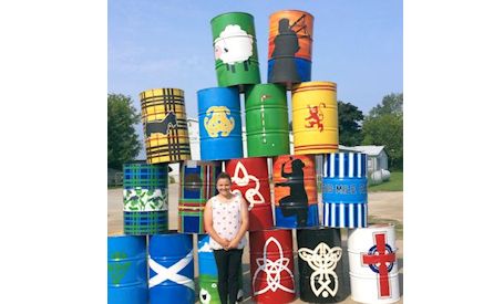 College student inspired by Celtic symbols in painting garbage cans for Kincardine